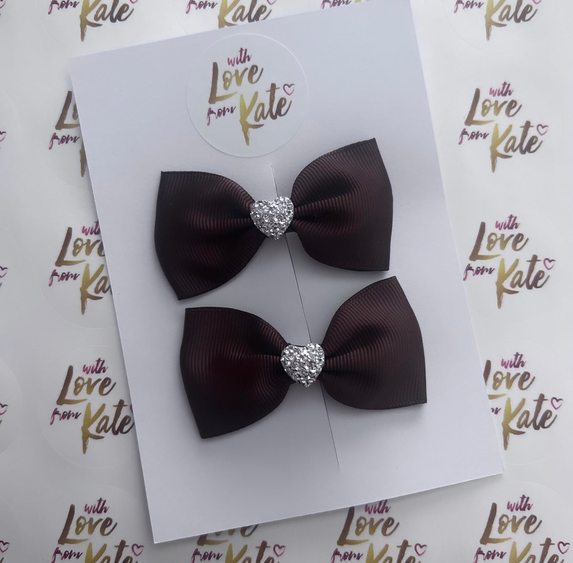 Brown pinch bow with heart centre