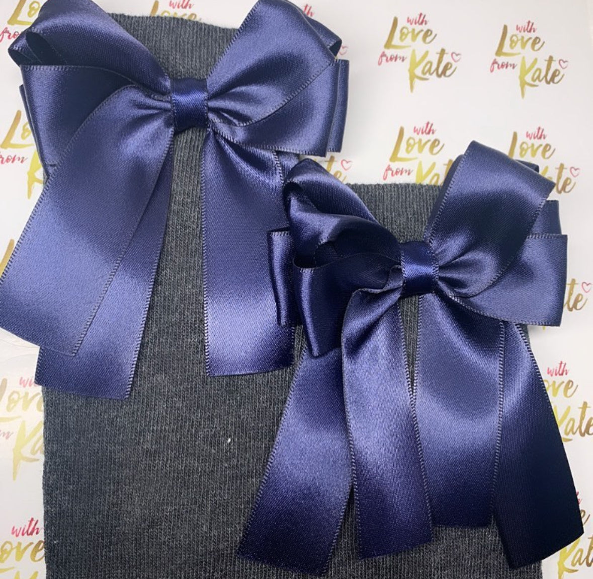 Grey socks with navy long tail bows