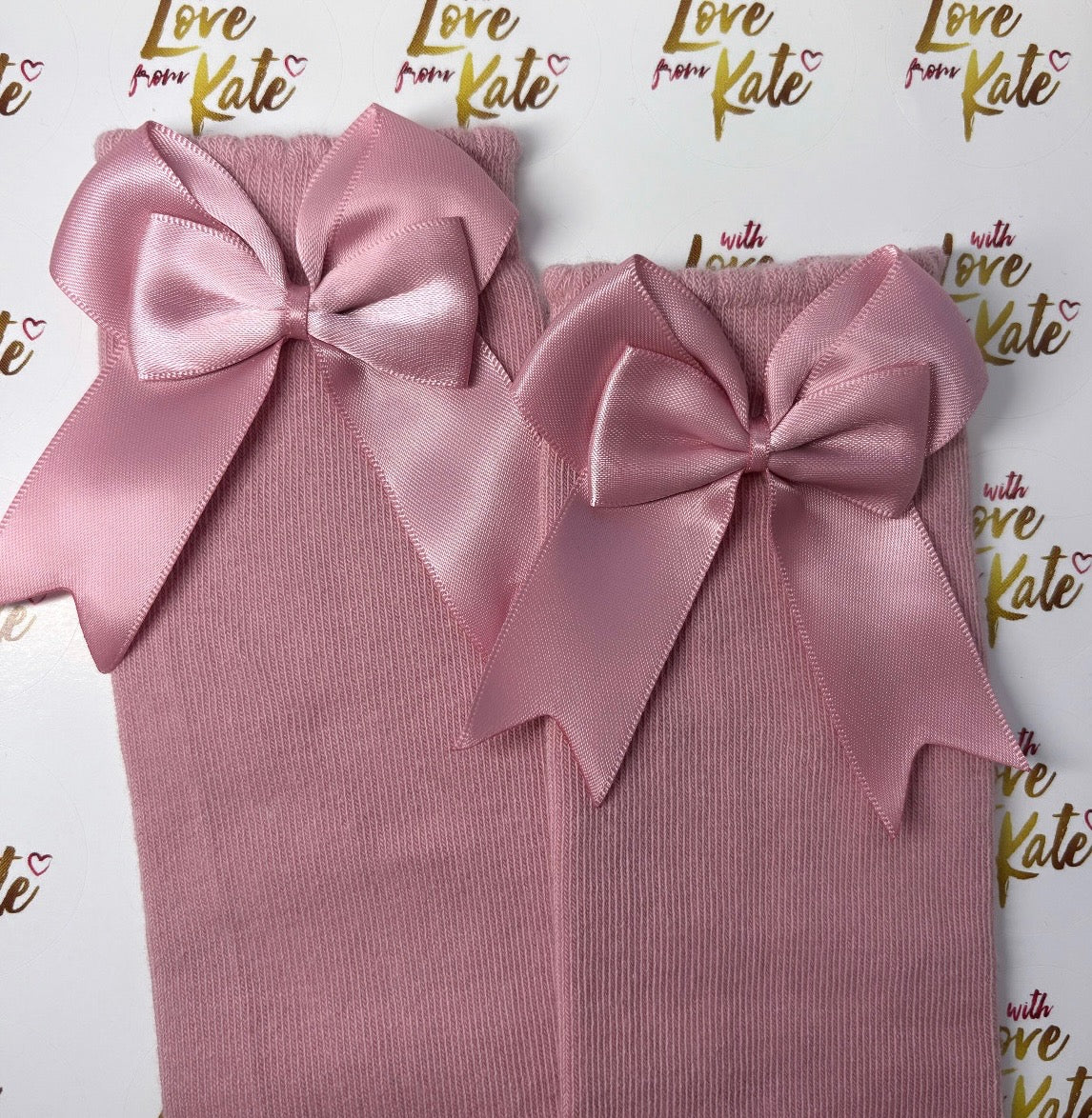 Dusky pink knee high socks with bows