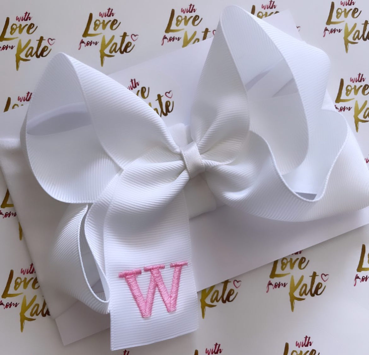 White with baby pink embroidered initial baby headband