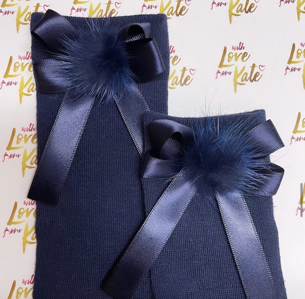 Navy socks with navy pom pom long tail bows
