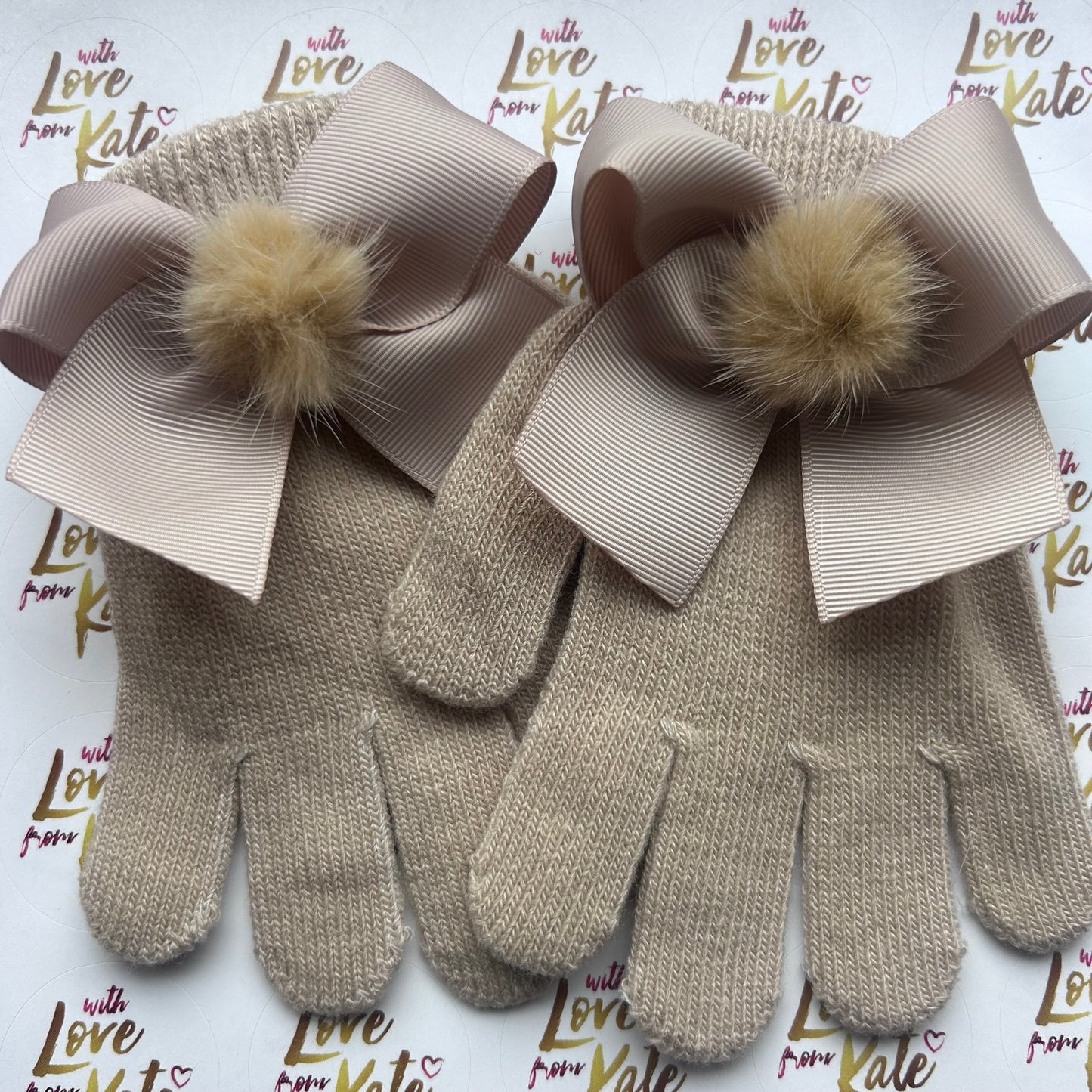 Beige gloves with bows and pom poms