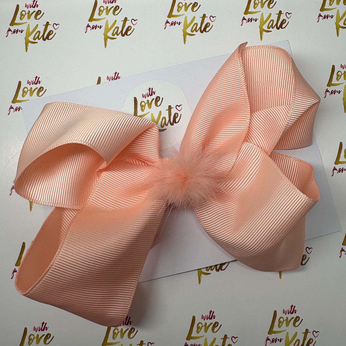 Peach boutique bow with Pom Pom centre