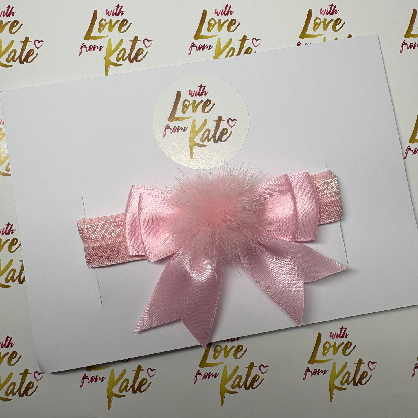 Pink satin bow baby headband with pom pom