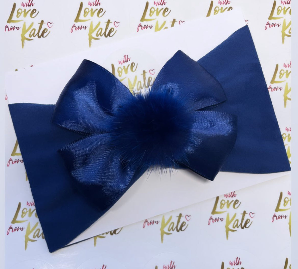 Navy double tux bow baby headband with pom pom centre