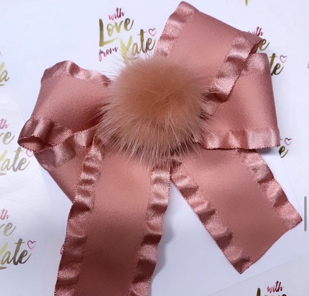 Dusky pink ruffle ribbon longtail bow with pom pom centre
