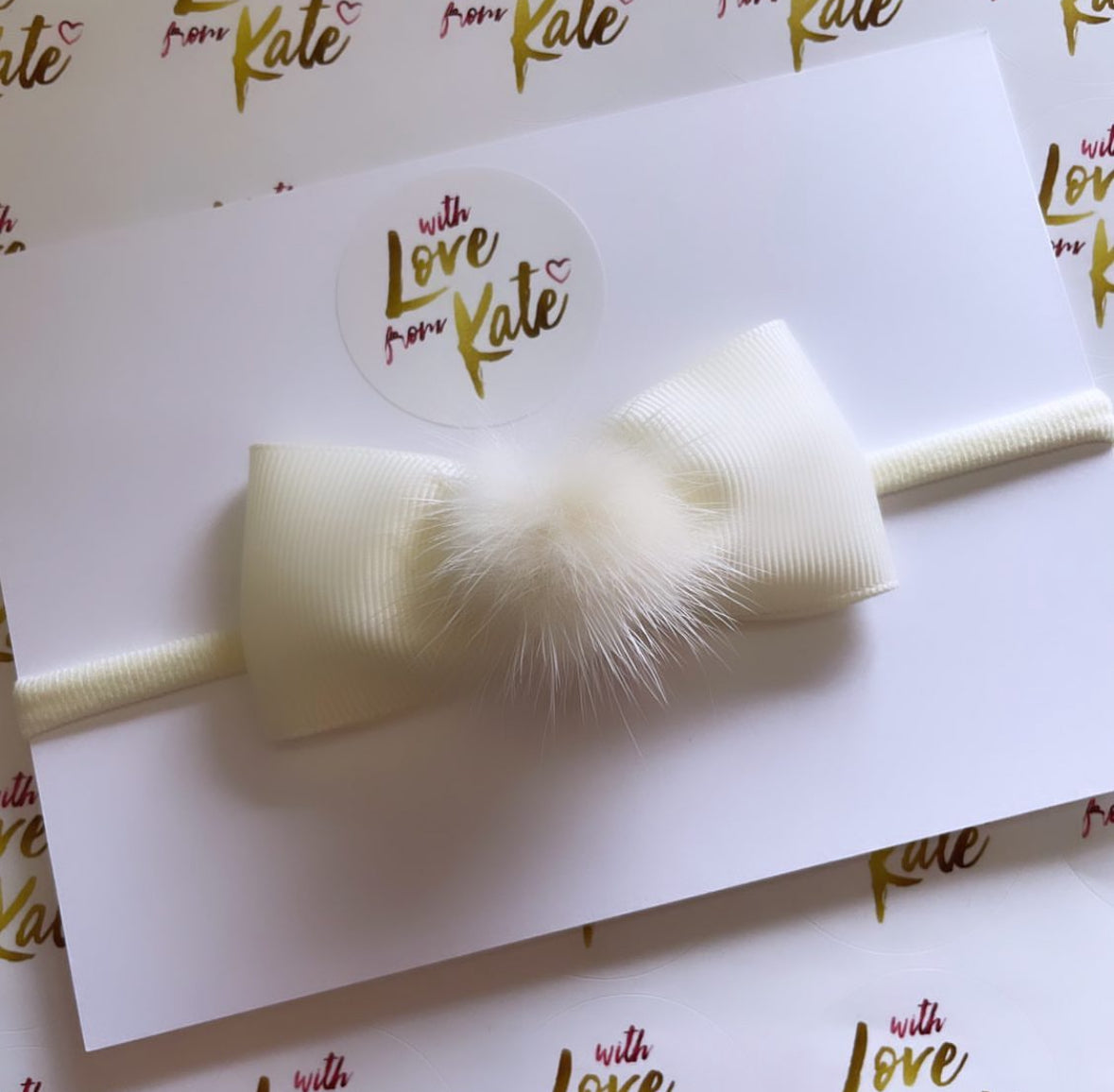 Cream Pinch bow baby headband with pom pom