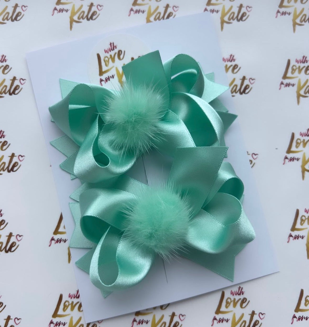 Mint green boutique stacked bow with pom pom