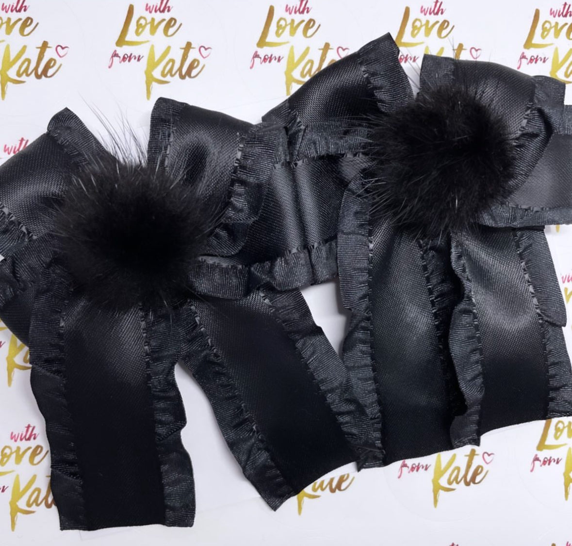 Black ruffle ribbon longtail bow with pom pom centre