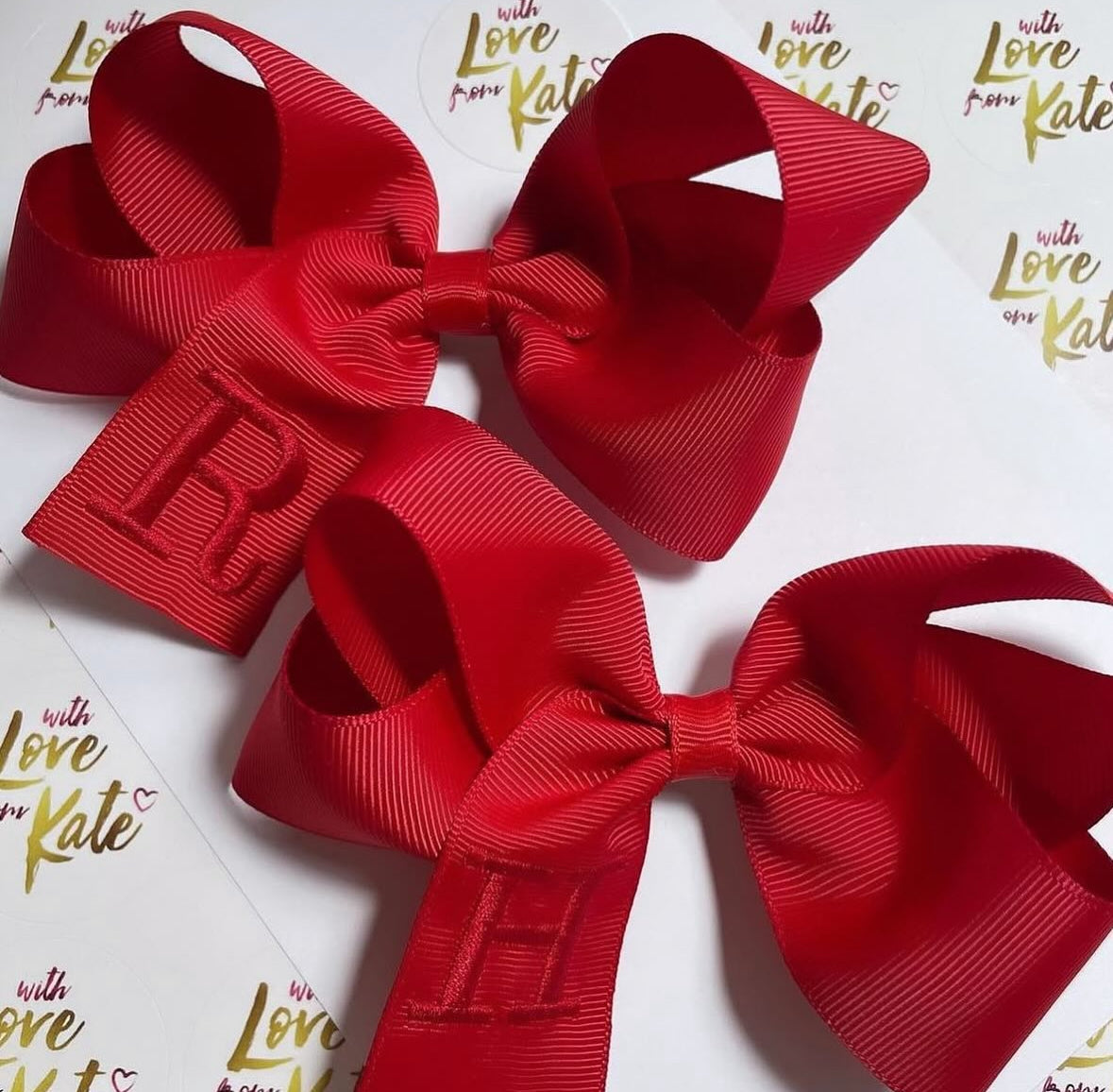 Red boutique bow with red embroidery