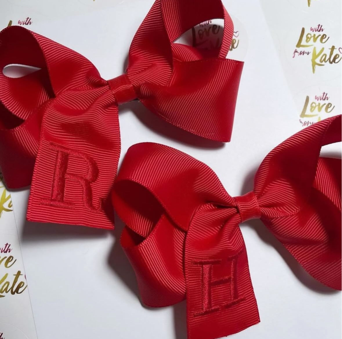 Red boutique bow with red embroidery