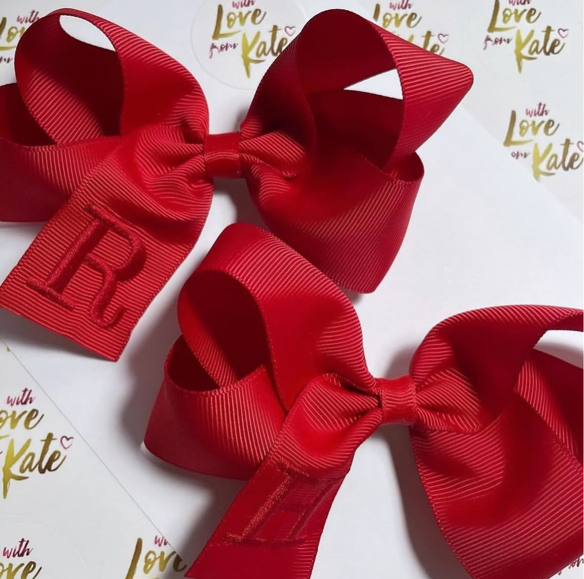 Red boutique bow with red embroidery