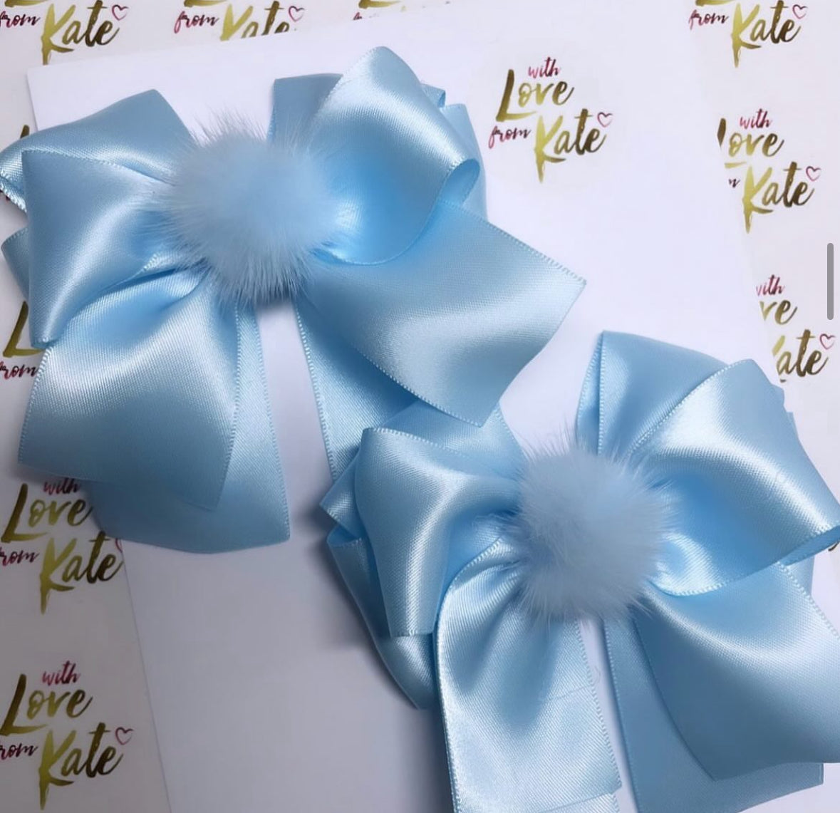 Light blue XL short tail bow with Pom Pom centre