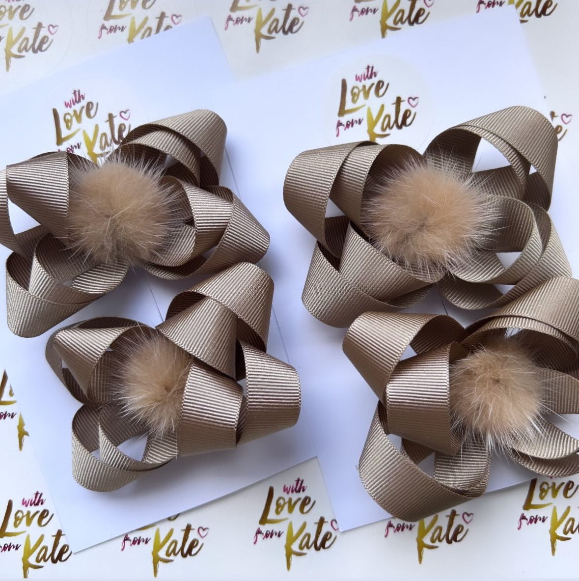 Beige butterfly bow with pom pom centre