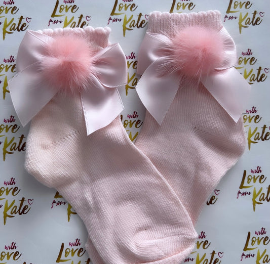 Pink socks with satin bows and Pom Poms