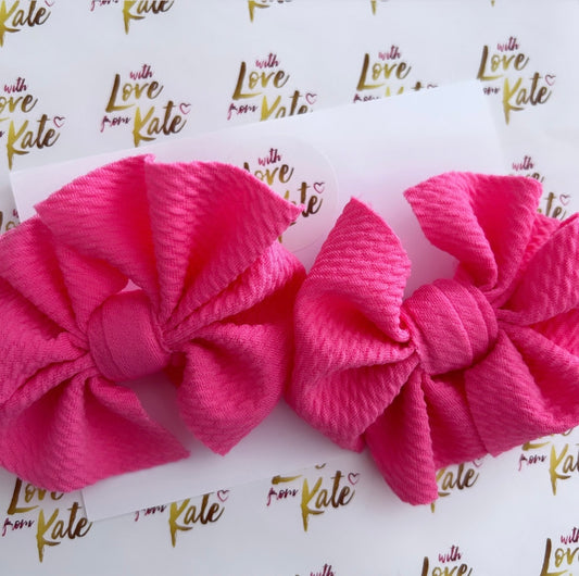 2 x Cerise fabric pinwheel bows