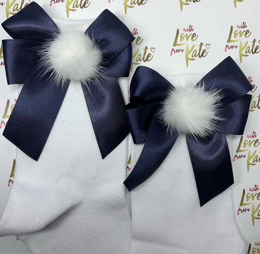 White socks with navy pom pom long tail bows