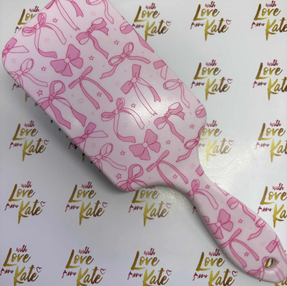 Bow print paddle brush