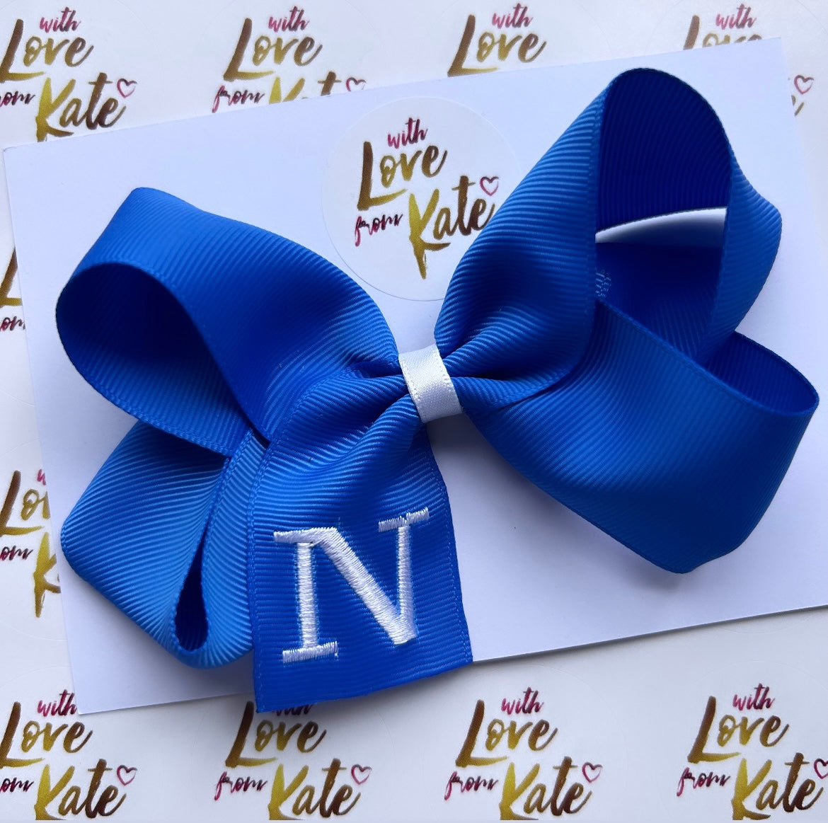 Royal blue embroidered ‘N’ boutique bow