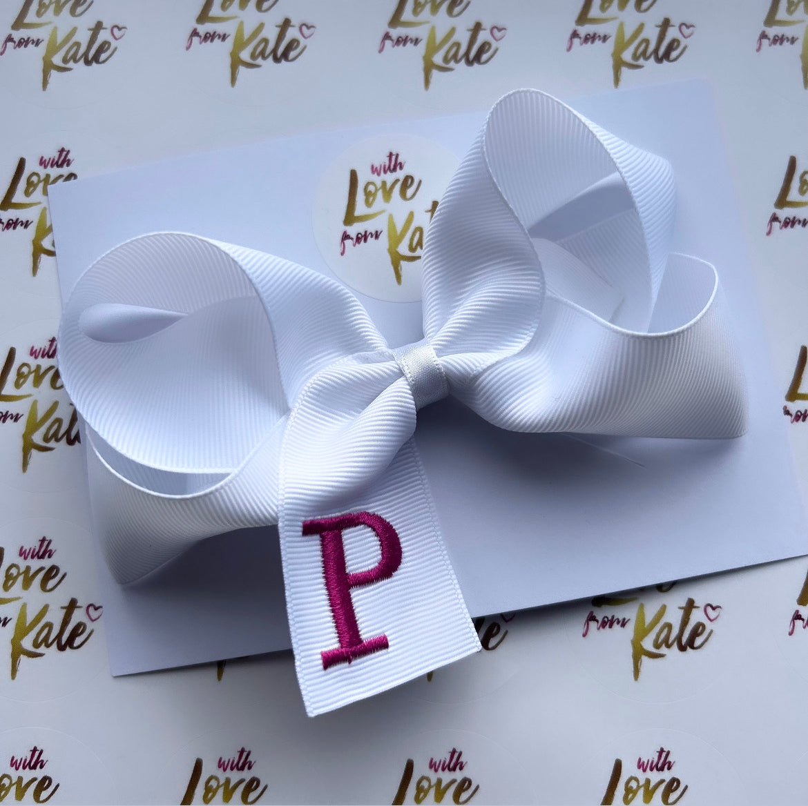 Embroidered ‘P’ boutique bow