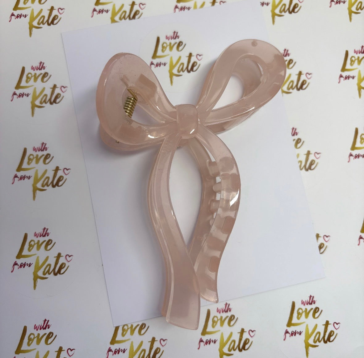 Clear pink ribbon bow claw clip