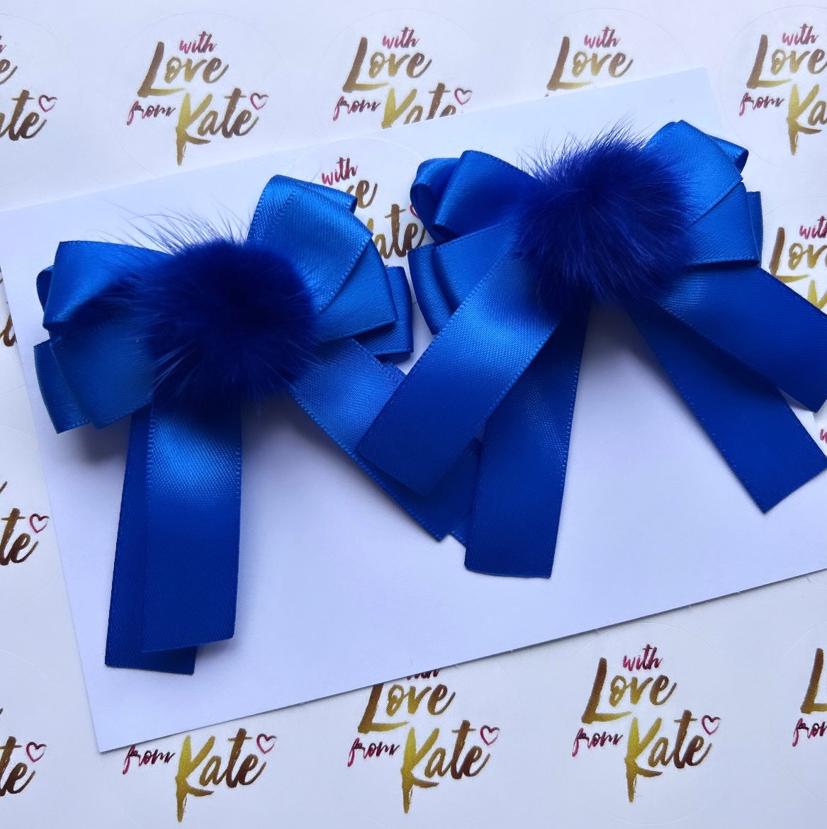 2 x Royal blue short tail bows with Pom poms