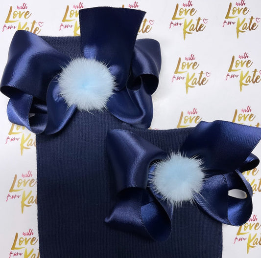 Navy socks with navy boutique bows with pom poms