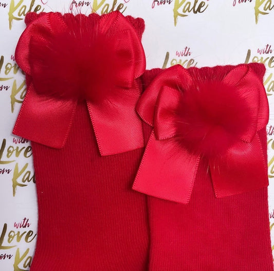 Red socks with red pom pom long tail bows
