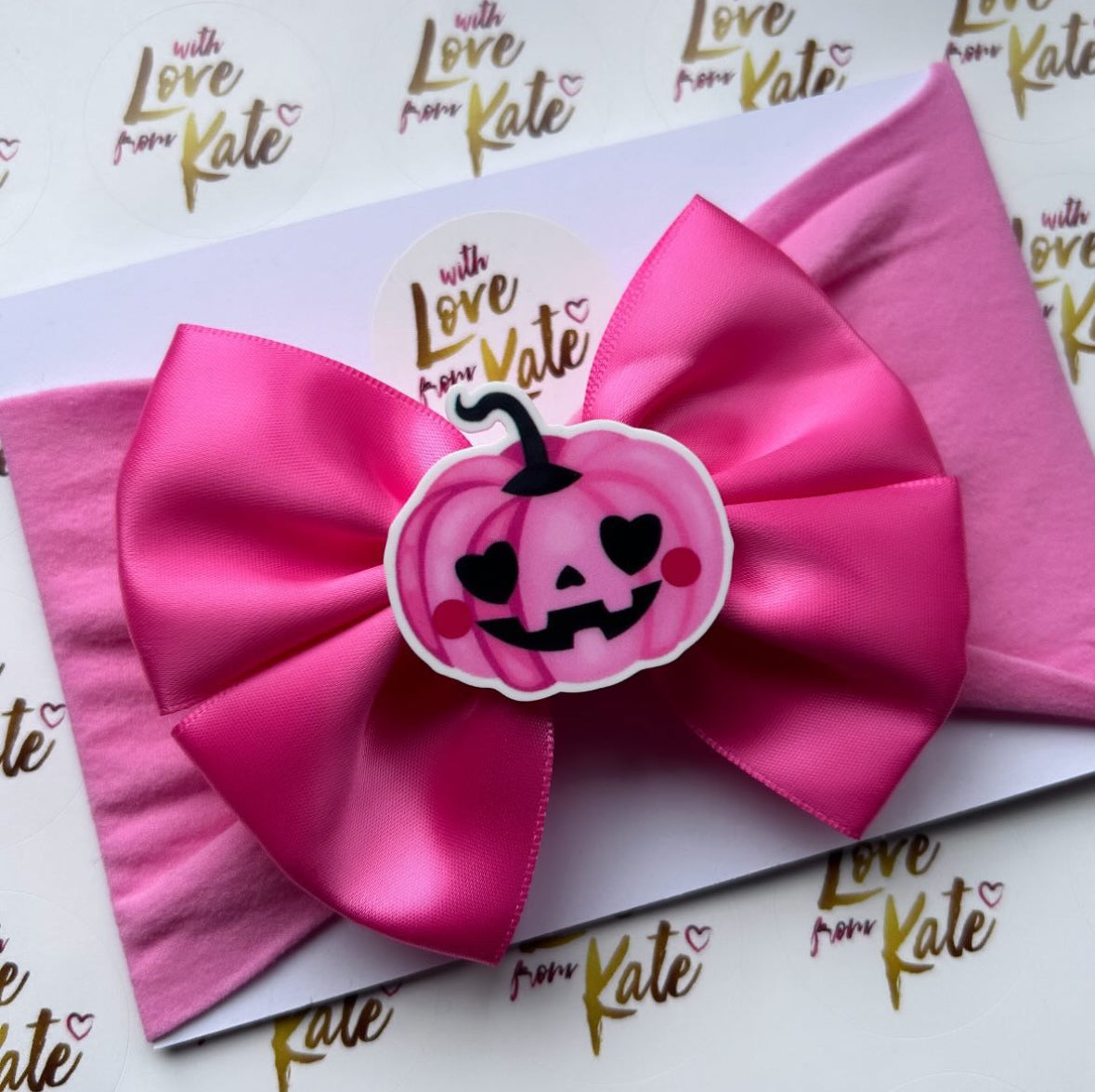 Pink ‘pumpkin centre’ double tux bow baby headband