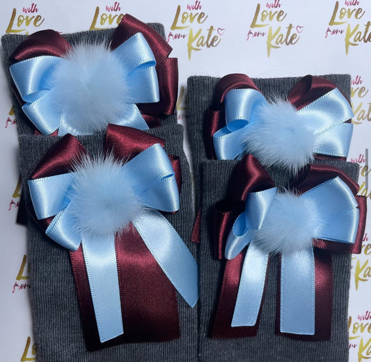 Grey socks with maroon & light blue long tail bows with pom poms