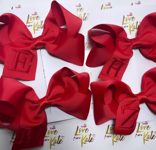 Red boutique bow with red embroidery