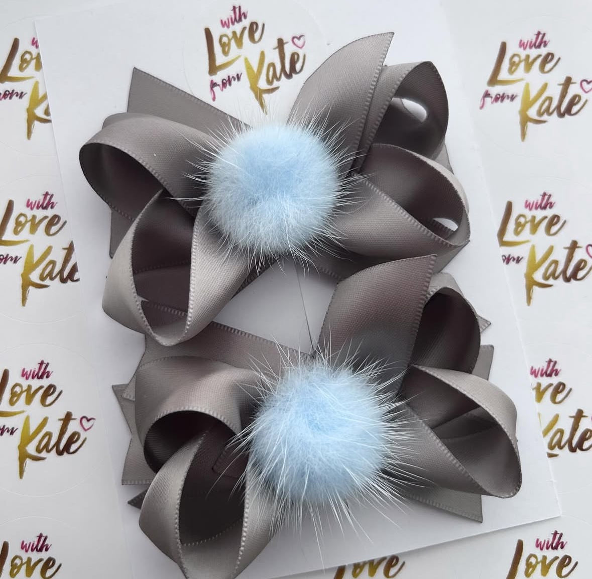 Grey & light blue pom pom stacked bow