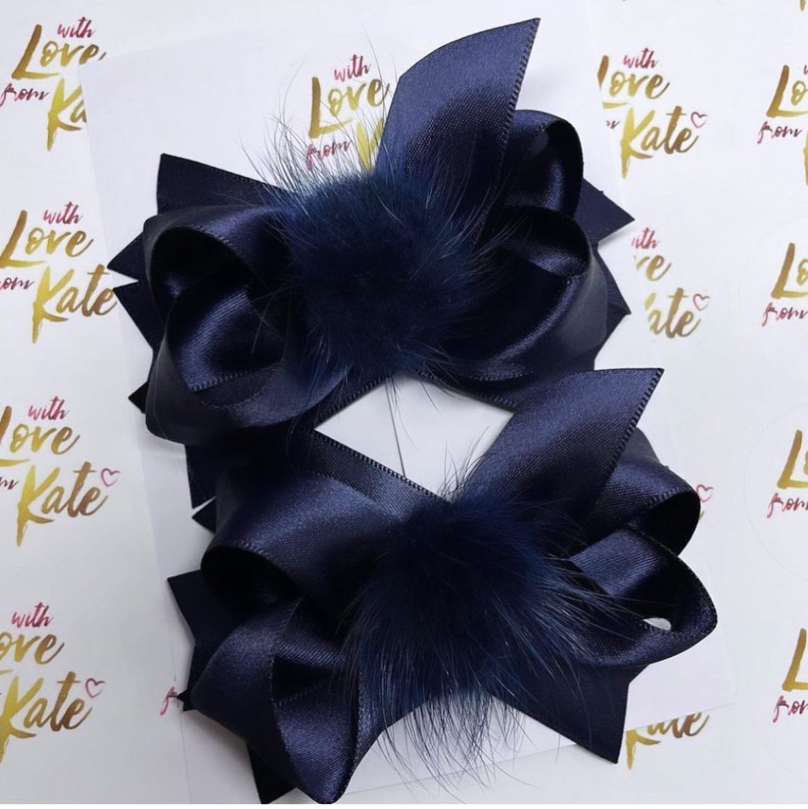 Navy pom pom stacked bow